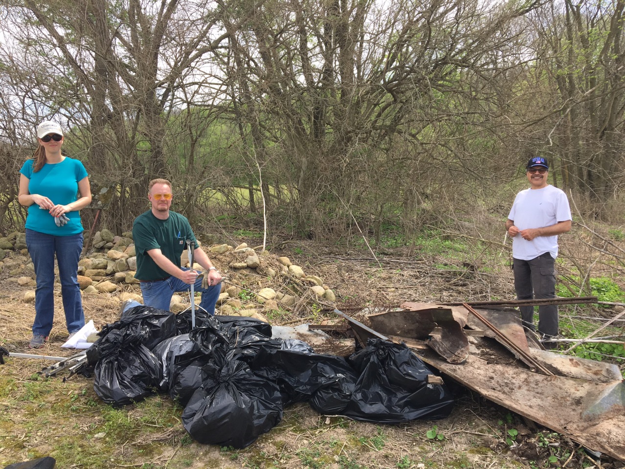 Ed Hammer, Elyse Rosengarten, and Aftab Barki proudly pose behind the garbage removed from the park by the twelve Watermark volunteers..jpg